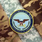 Department of War insignia on camouflage fabric
