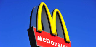 McDonalds logo on a pole clear sky