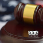 Hidden Danger — EPA Knew, Did Nothing? A gavel resting on a wooden base with dice spelling 'EPA' in front of it