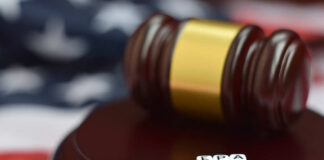 A gavel resting on a wooden base with dice spelling 'EPA' in front of it