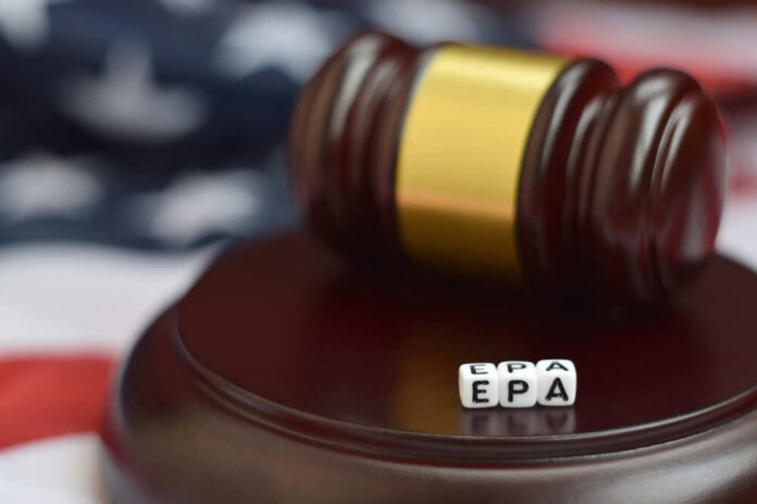 A gavel resting on a wooden base with dice spelling 'EPA' in front of it