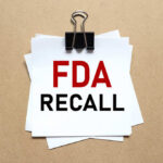 Blueberries RECALLED — FDA’s Highest Alert A notice labeled 'FDA RECALL' clipped to white papers on a brown background