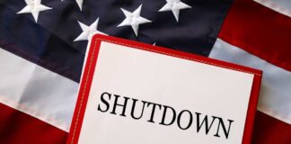A shutdown notice placed on an American flag