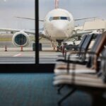 Engine Failure; Emergency Landing; Airport Shuts Down View of an airplane from an airport waiting area
