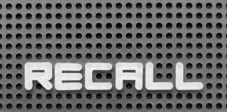 The word 'RECALL' displayed on a perforated surface
