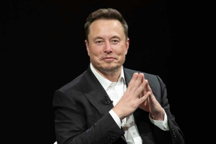 shutterstock_2318800323.jpg Elon Musk in a suit talking.