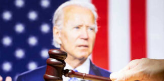 Joe Biden with a hand holding a gavel