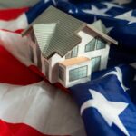 A model house placed on an American flag
