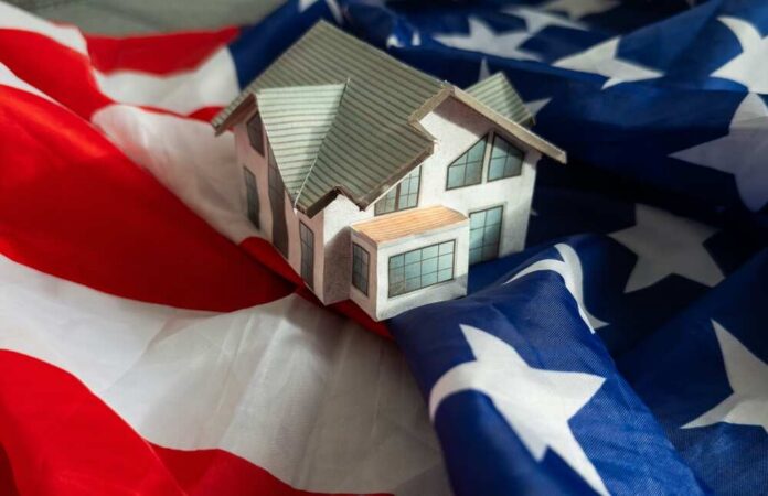 A model house placed on an American flag