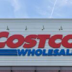 Costco Wholesale store sign against a blue sky