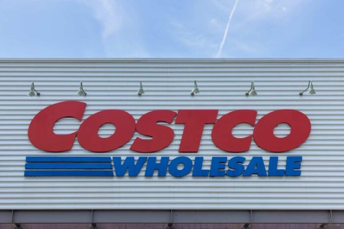 Costco Wholesale store sign against a blue sky