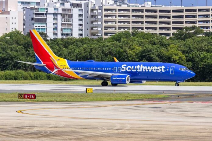 Southwest Airlines airplane taxiing on the runway