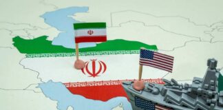 A map of Iran with flags of Iran and the United States and a toy military ship