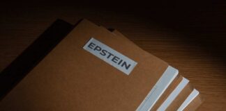 Stack of brown file folders labeled 'EPSTEIN'