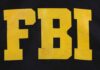 FBI logo displayed in large yellow letters on a black background