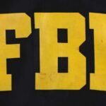 Ex-FBI Chief INDICTED Over Seashell Death Code?! FBI logo displayed in large yellow letters on a black background