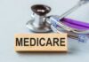 Wooden block with MEDICARE text next to a stethoscope