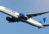Airplane flying in clear blue sky daytime