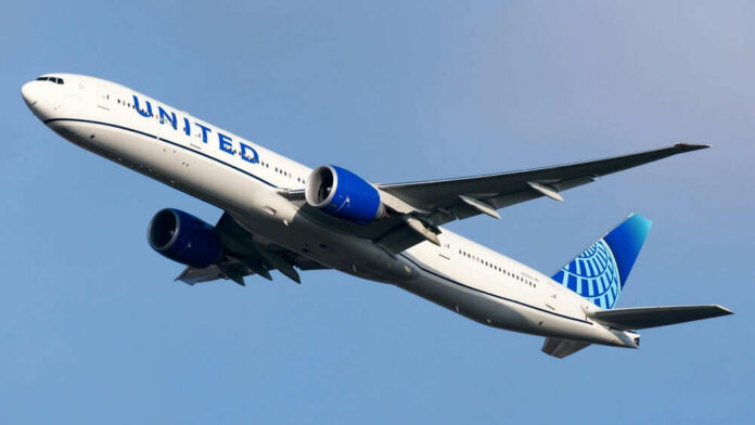 Airplane flying in clear blue sky daytime