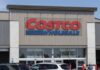 Exterior view of a Costco Wholesale store with a clear blue sky