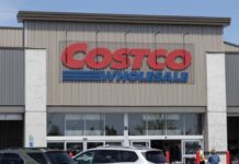 Exterior view of a Costco Wholesale store with a clear blue sky