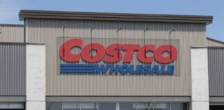 Exterior view of a Costco Wholesale store with a clear blue sky