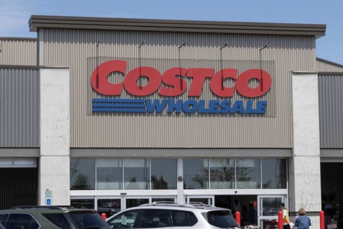 Exterior view of a Costco Wholesale store with a clear blue sky