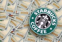 Starbucks coffee logo on a background of hundred dollar bills