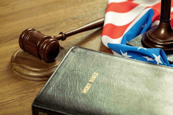 Gavel, Holy Bible, and American flag on a desk.
