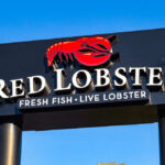 Red Lobster restaurant sign with red lobster logo.