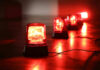 Massacre Foiled: Terror Plot Revealed Red emergency lights on dark floor, illuminating the area.