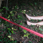 HORRIFYING Discovery — Six Dead Bodies Bare feet visible near caution tape in a wooded area