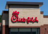 Chick-fil-A restaurant sign on a brick building