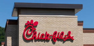 Chick-fil-A restaurant sign on a brick building