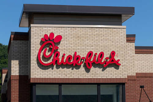 Chick-fil-A restaurant sign on a brick building