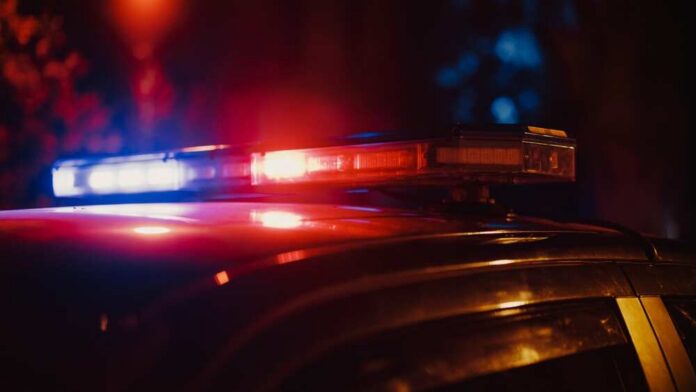 Close-up,Shot,Of,Police,Car,Siren,Lights.,Offices,Of,The Close-up of a police car's emergency lights at night