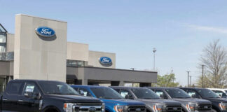 Ford dealership with trucks lined up outside