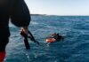 Deadly Dive: Maldivian Cave Mystery Two scuba divers in the ocean being assisted by a person holding a rescue line