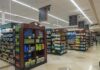 Interior view of a grocery store aisle with shelves of food and beverages