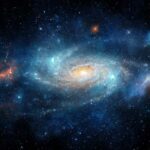 Astronomers Stunned: Dead Ice Ball Shows Life A vibrant galaxy with swirling colors and bright stars in the cosmos