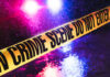 Family Festival Turns Into War Zone Crime scene tape with flashing lights in background.