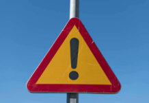 Foreign Hit Network Attacked U.S. Consulate? Triangular warning sign with exclamation mark.