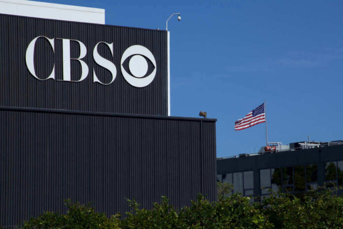 shutterstock_1491307826 CBS building with American flag in background.