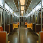 Subway Horror, Slap-On Time Empty subway train with orange seats.