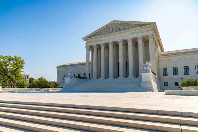 shutterstock_2431677511 United States Supreme Court building exterior, sunny day.