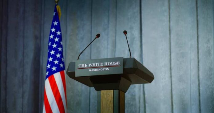 Speech,Tribune,For,Government,Representative,Of,The,United,States,Or Press podium with the White House sign and an American flag in the background
