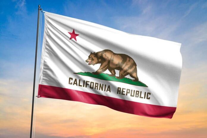 Flag,Of,California,Waving,Flag,On,Sunset,View California state flag waving against a sunset sky