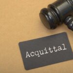 VIDEO: Killing of Black Teen Ends In Acquittal A gavel next to a card that reads 'Acquittal'