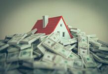 Congress’ Housing Fix Backfires? A small model house surrounded by stacks of money