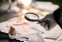 American Tourist Vanishes, Volunteers Find What Police Missed Gloved hand holding a magnifying glass over scattered forensic documents